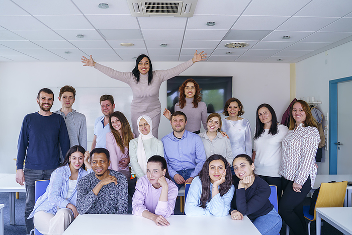 Smiling multi-ethnic group of friends in classroom