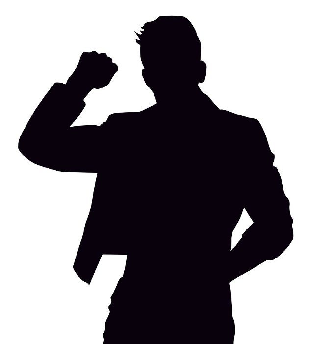 Silhouette of man with raised fist_upper body