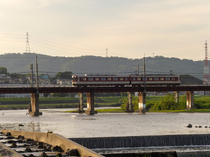 Kintetsu Domyoji Line train crossing the Yamato River in the morning glow