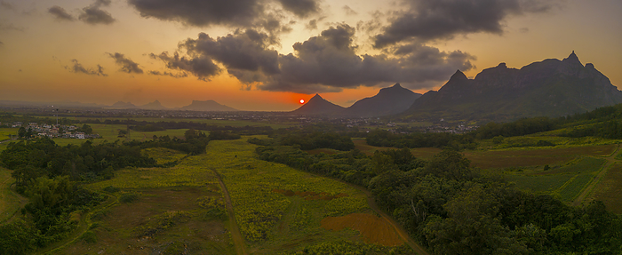 View of golden sunset behind Long Mountain and patwork of green fields, Mauritius, Indian Ocean, Africa View of golden sunset behind Long Mountain and patchwork of green fields, Mauritius, Indian Ocean, Africa, by Frank Fell