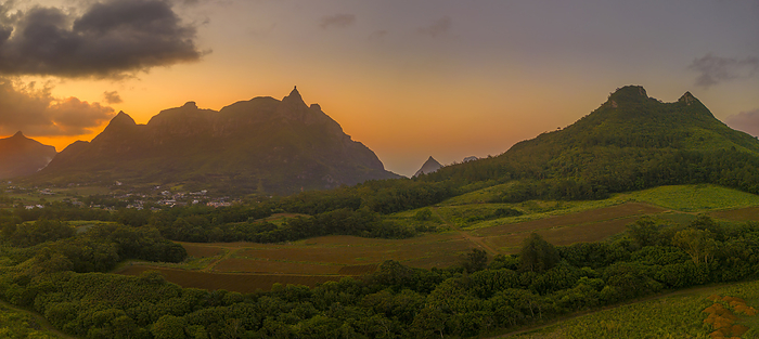 View of golden sunset behind Long Mountain and patwork of green fields, Mauritius, Indian Ocean, Africa View of golden sunset behind Long Mountain and patchwork of green fields, Mauritius, Indian Ocean, Africa, by Frank Fell