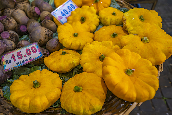View of produce and market stall in Central Market in Port Louis, Port Louis, Mauritius, Indian Ocean, Africa View of produce including patty pan squash on market stall in Central Market in Port Louis, Port Louis, Mauritius, Indian Ocean, Africa, by Frank Fell