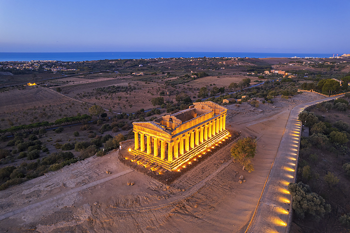 The illuminated temple of Concordia seen from the drone at dawn, Agrigento s valley of the Temples, UNESCO world heritage site, Sicily, South of Italy, Italy, Europe The illuminated Temple of Concordia seen from a drone at dawn, Valley of the Temples, UNESCO World Heritage Site, Agrigento, Sicily, Italy, Mediterranean, Europe, by Paolo Graziosi