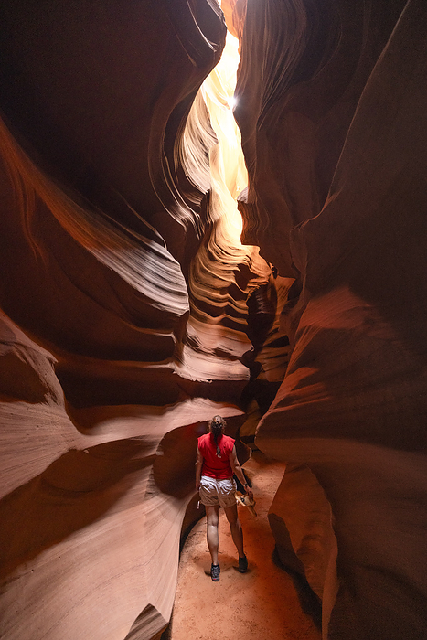 A girl enjoy the beautiful view the Upper Antelope Canyon during a summer sunny day, Page, Arizona, United States of America A girl enjoys the beautiful view of the Upper Antelope Canyon on a sunny summer day, Page, Arizona, United States of America, North America, by carlo alberto conti