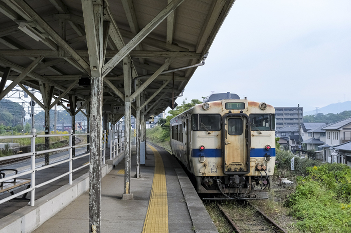 Retro-style local train departing from Harada Station