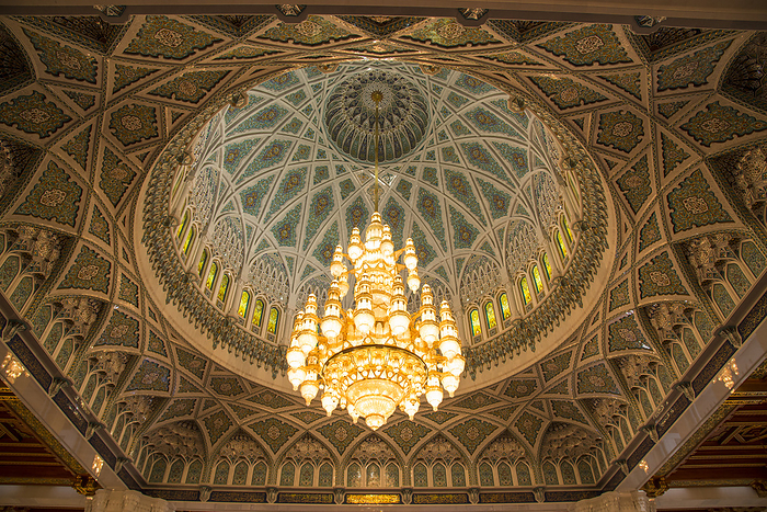 Chandelier above the praying hall inside the Sultan Qaboos Grand Mosque, viewed from directly below; Muscat, Oman, by Michael Melford / Design Pics