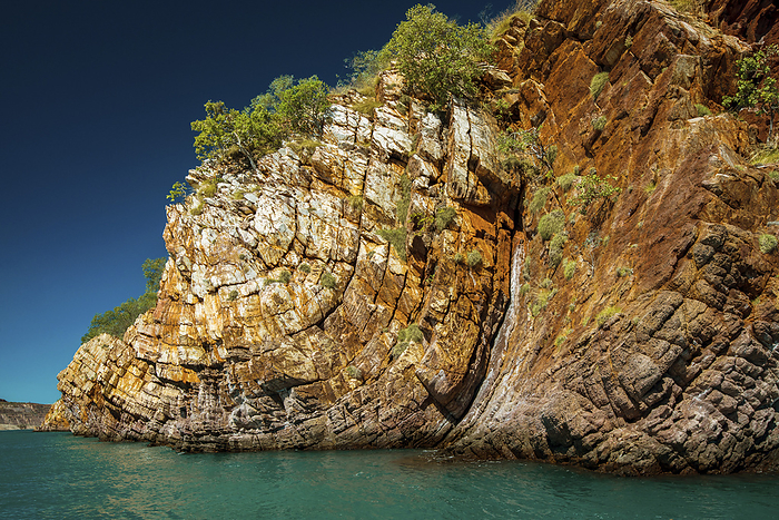 Nares Point, showing deformation of the sandstone strata by eons of geological forces; Kimberley Region, Western Australia, Australia, by Michael Melford / Design Pics
