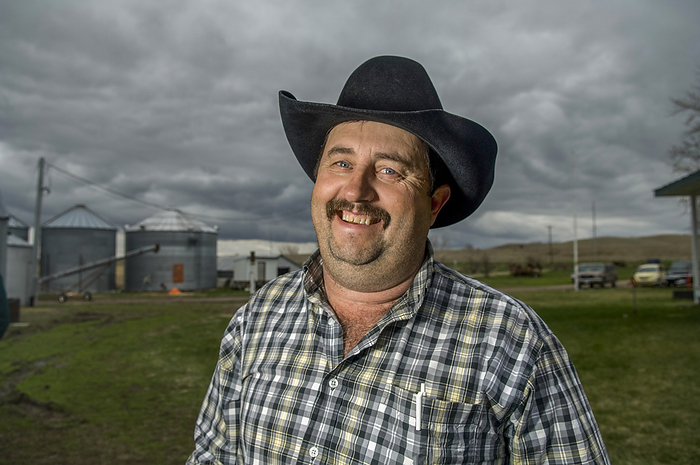 Portrait of a smiling cowboy on his farm; Burwell, Nebraska, United States of America, by Joel Sartore Photography / Design Pics