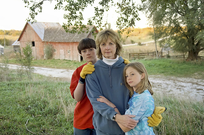 Portrait of a mother and her two children posing on a farm; Dunbar, Nebraska, United States of America, by Joel Sartore Photography / Design Pics
