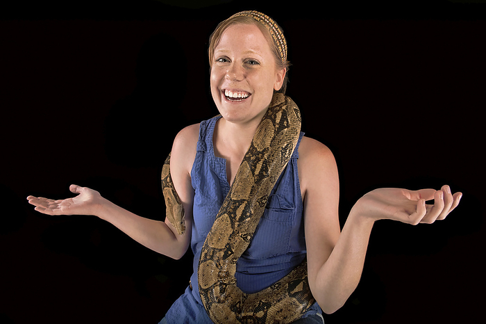 Young woman holds a Red-tailed boa constrictor, Boa constrictor constrictor; Lincoln, Nebraska, United States of America, by Joel Sartore Photography / Design Pics