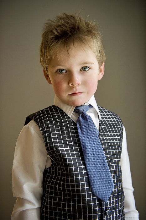 Young boy in formal wear poses for a photograph; Lincoln, Nebraska, United States of America, by Joel Sartore Photography / Design Pics