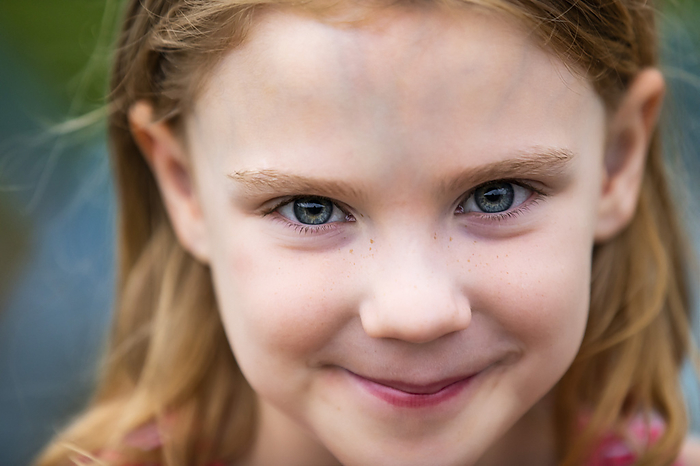 Portrait of a young girl smiling and looking at the camera; Edmonton, Alberta, Canada, by LJM Photo / Design Pics