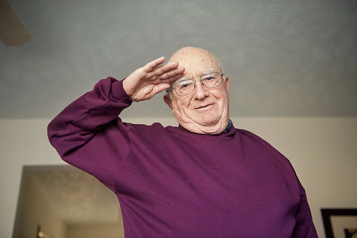 Elderly man salutes the camera; Elkhorn, Nebraska, United States of America, by Joel Sartore Photography / Design Pics