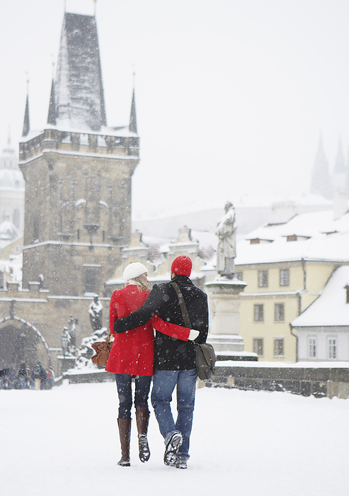 Couple Walking in Snow, Prague, Czech Republic, by Masterfile / Design Pics
