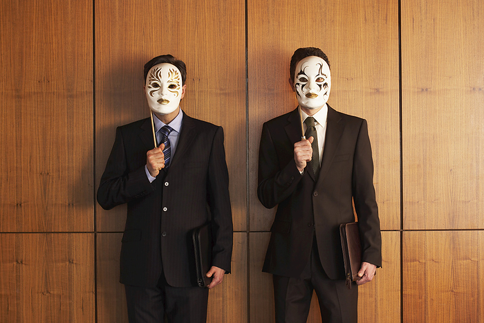 Businessmen with Theatrical Masks, by Masterfile / Design Pics