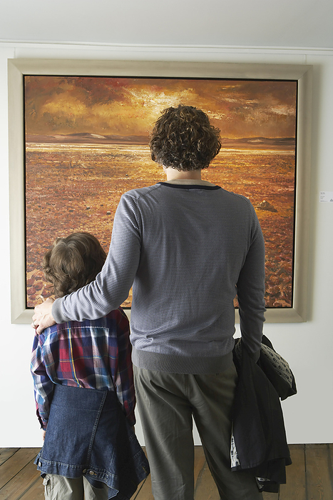 Father and Son in Art Gallery, by Masterfile / Design Pics