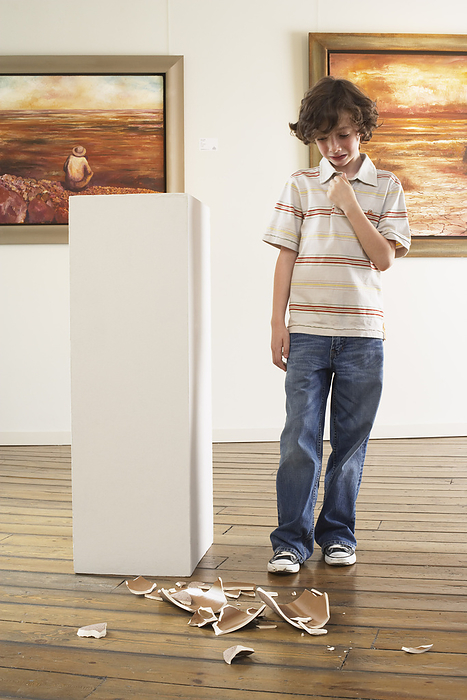 Child Breaking Art in Gallery, by Masterfile / Design Pics
