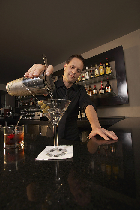 Bartender Pouring Drink, by Masterfile / Design Pics