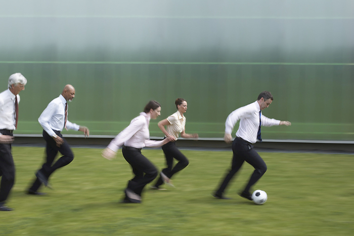 Business People Playing Soccer, by Masterfile / Design Pics