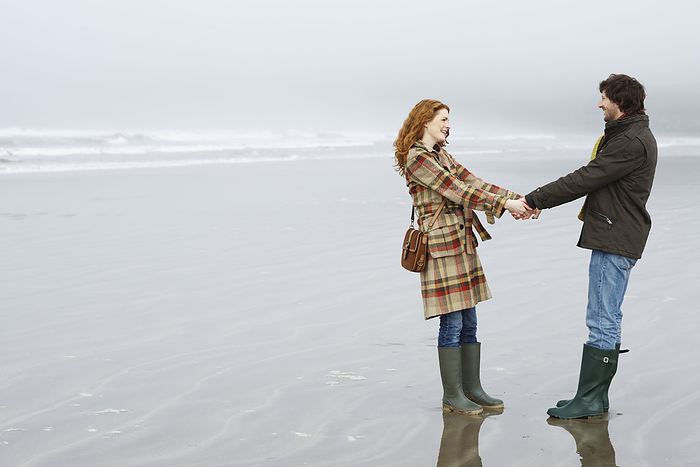 Couple On Beach, Ireland, by Masterfile / Design Pics