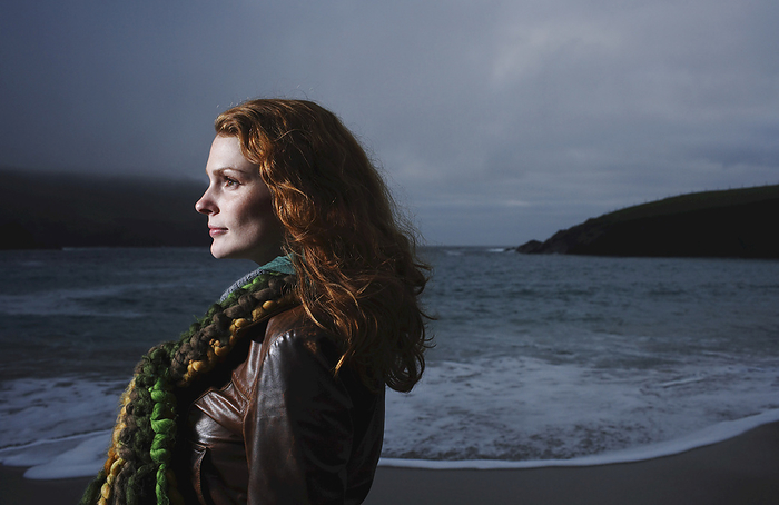 Portrait of Woman on Beach, Ireland, by Masterfile / Design Pics