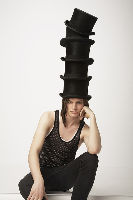 Man Wearing Top Hats, by Masterfile / Design Pics