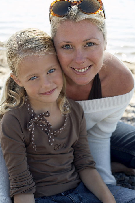 Portrait of Mother and Daughter At Beach, by Masterfile / Design Pics