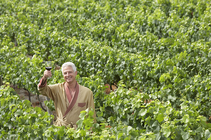 Portrait of Man in Vineyard, by Masterfile / Design Pics
