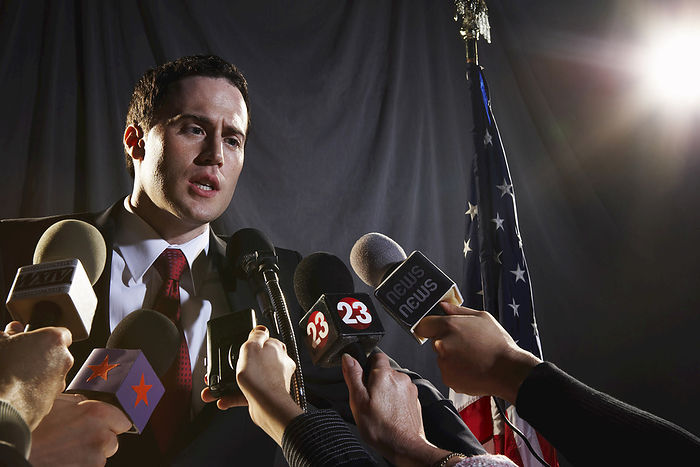 Reporters Interviewing Politician, by Masterfile / Design Pics