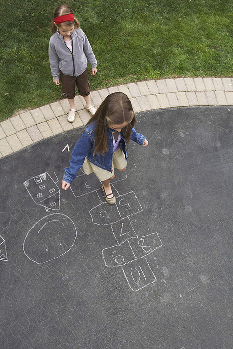 Girls Playing Hopscotch, by Masterfile / Design Pics