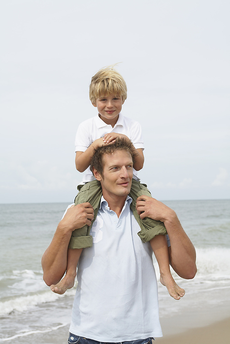 Portrait of Father and Son at Beach, by Masterfile / Design Pics