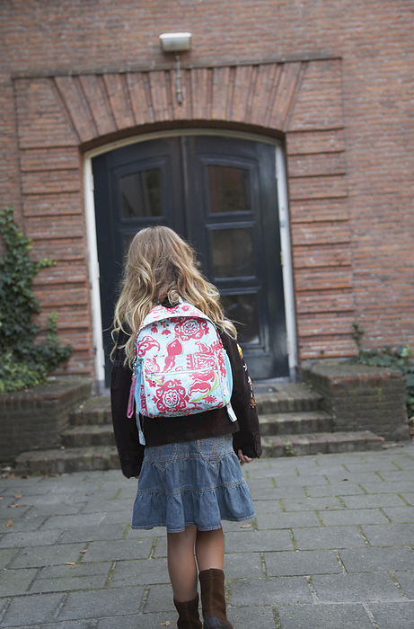 Back View of Girl Going to School, by Masterfile / Design Pics
