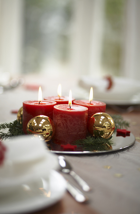 Christmas Candles at Dinner Table, by Masterfile / Design Pics