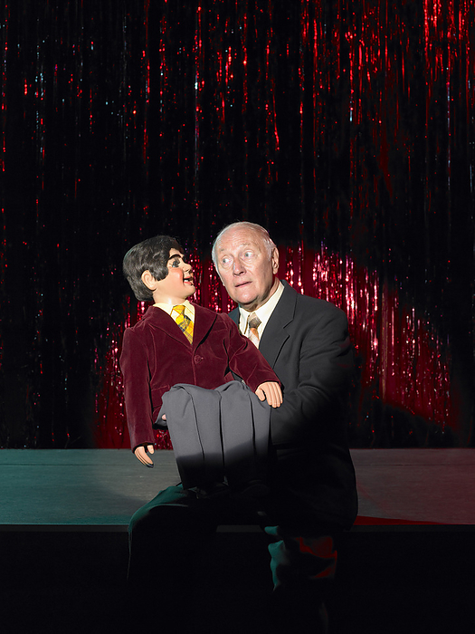Ventriloquist on Stage, by Masterfile / Design Pics