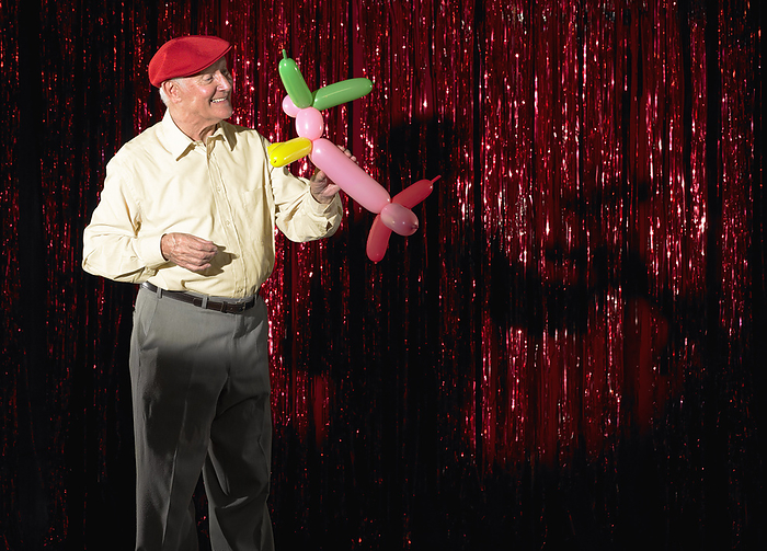 Performer with Balloon Animal, by Masterfile / Design Pics