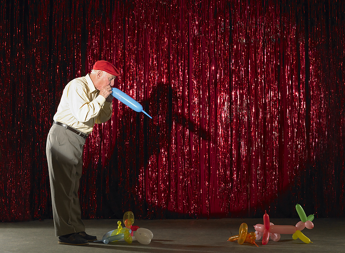 Performer with Balloon Animals, by Masterfile / Design Pics