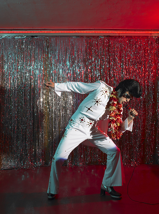 Elvis Impersonator on Stage, by Masterfile / Design Pics