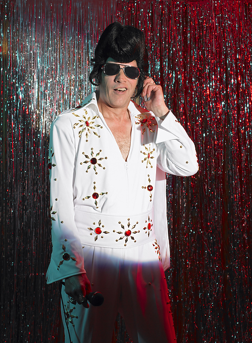 Elvis Impersonator on Stage, by Masterfile / Design Pics