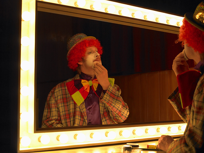 Clown Looking in Mirror, by Masterfile / Design Pics