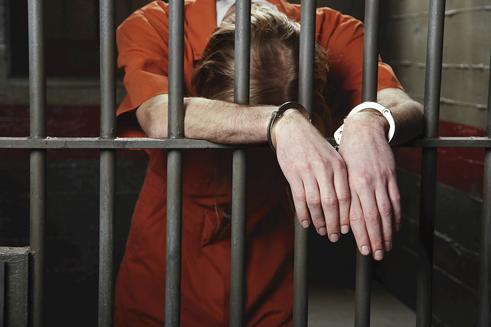 Man in Prison, by Masterfile / Design Pics