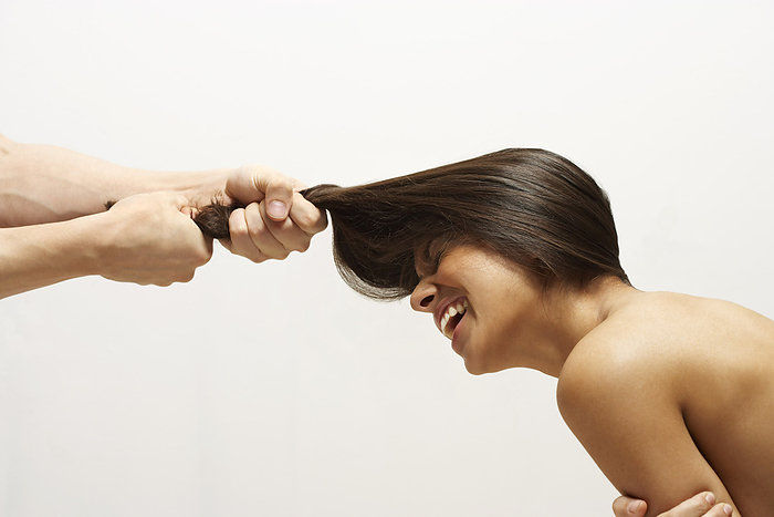 Man Pulling Woman's Hair, by Masterfile / Design Pics