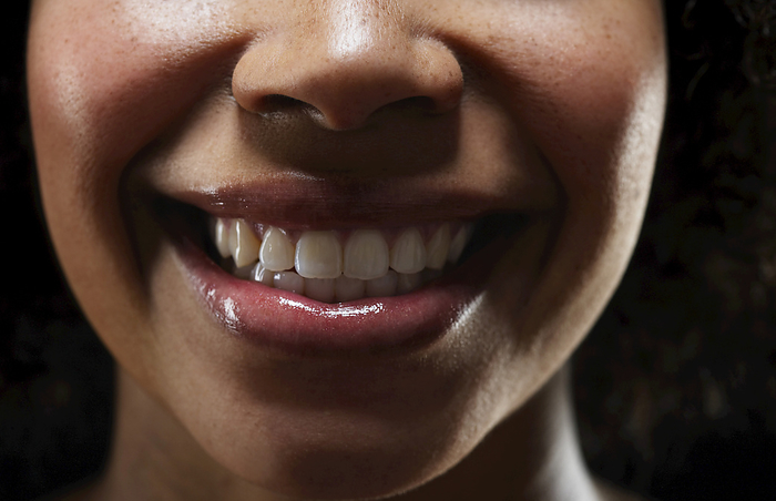 Close-Up of Woman's Mouth, by Masterfile / Design Pics
