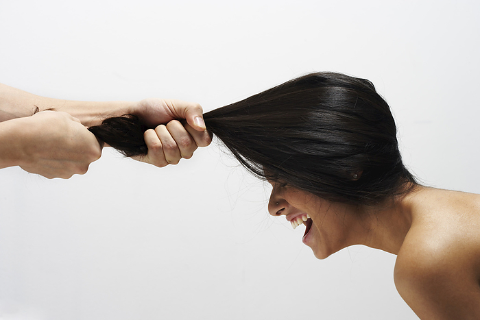 Man Pulling Woman's Hair, by Masterfile / Design Pics
