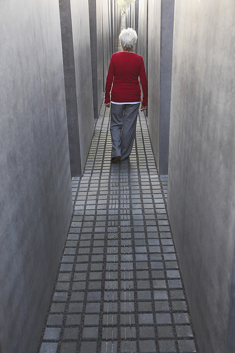 Woman Walking through the Memorial to the Murdered Jews of Europe, Berlin, Germany, by Masterfile / Design Pics