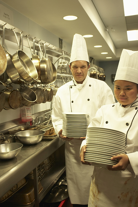 Chefs Carrying Plates, by Masterfile / Design Pics