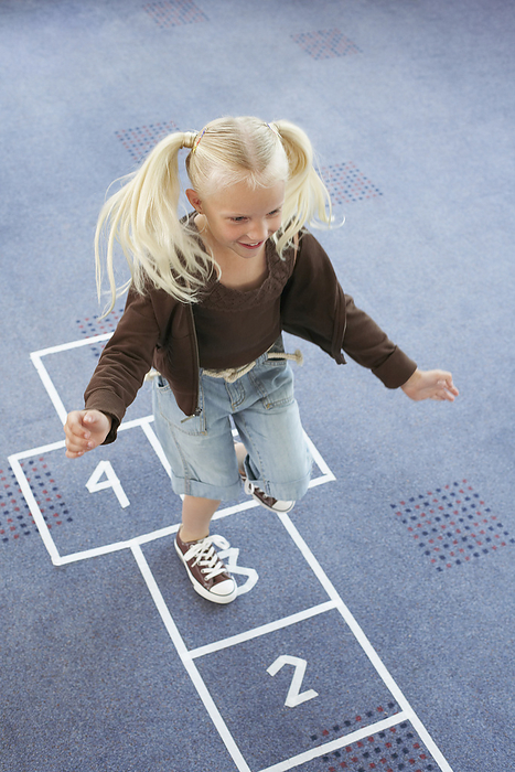Child Playing Hopscotch, by Masterfile / Design Pics