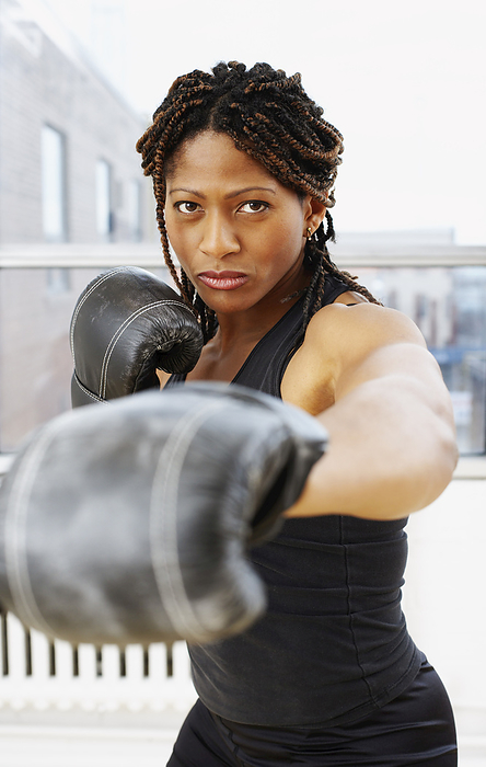 Portrait of Woman Boxing, by Masterfile / Design Pics
