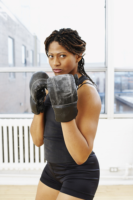 Portrait of Woman Boxing, by Masterfile / Design Pics