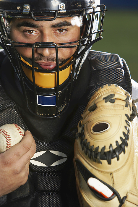 Baseball Player with Ball and Catcher's Mitt, by Masterfile / Design Pics