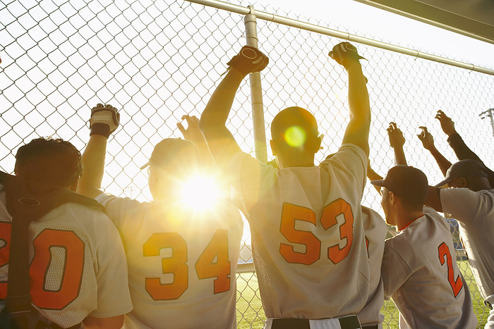 Baseball Players Cheering in Dugout, by Masterfile / Design Pics